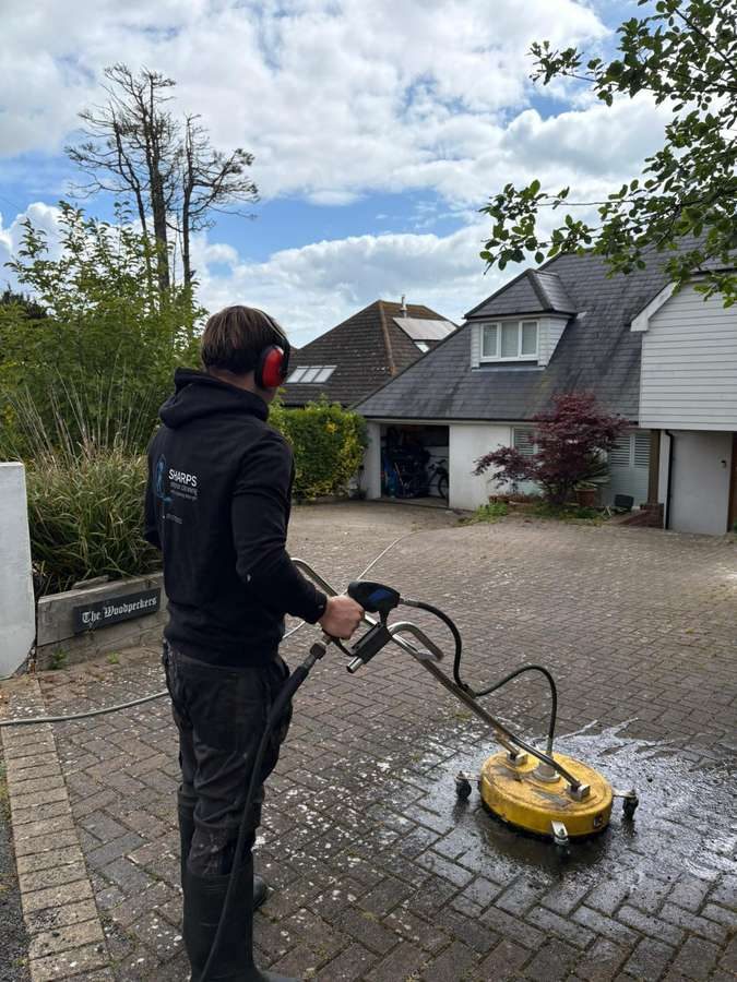 Sharps Exterior Cleaning team pressure washing a property in Kent